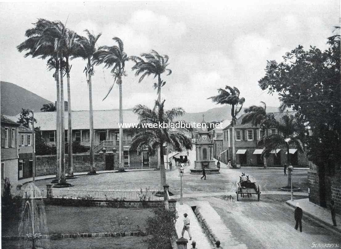 St. Christopher of St. Kitts, eersteling der Engelsch West-Indische Kolonin. Basseterre, hoofdstad van St. Kitts. De ingang der stad aan de zuidzijde. Links de sociteit