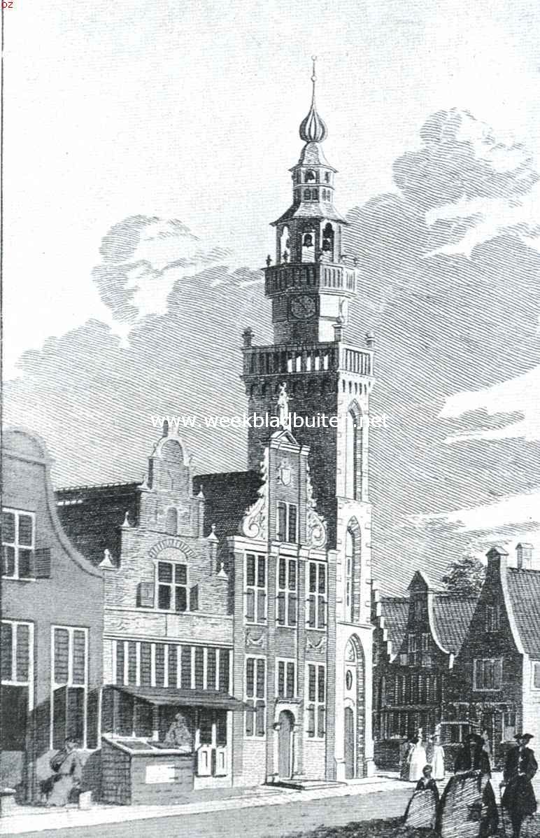 Monnikendam. De Speeltoren in het begin der achttiende eeuw. Links van den toren het voormalige Stadhuis