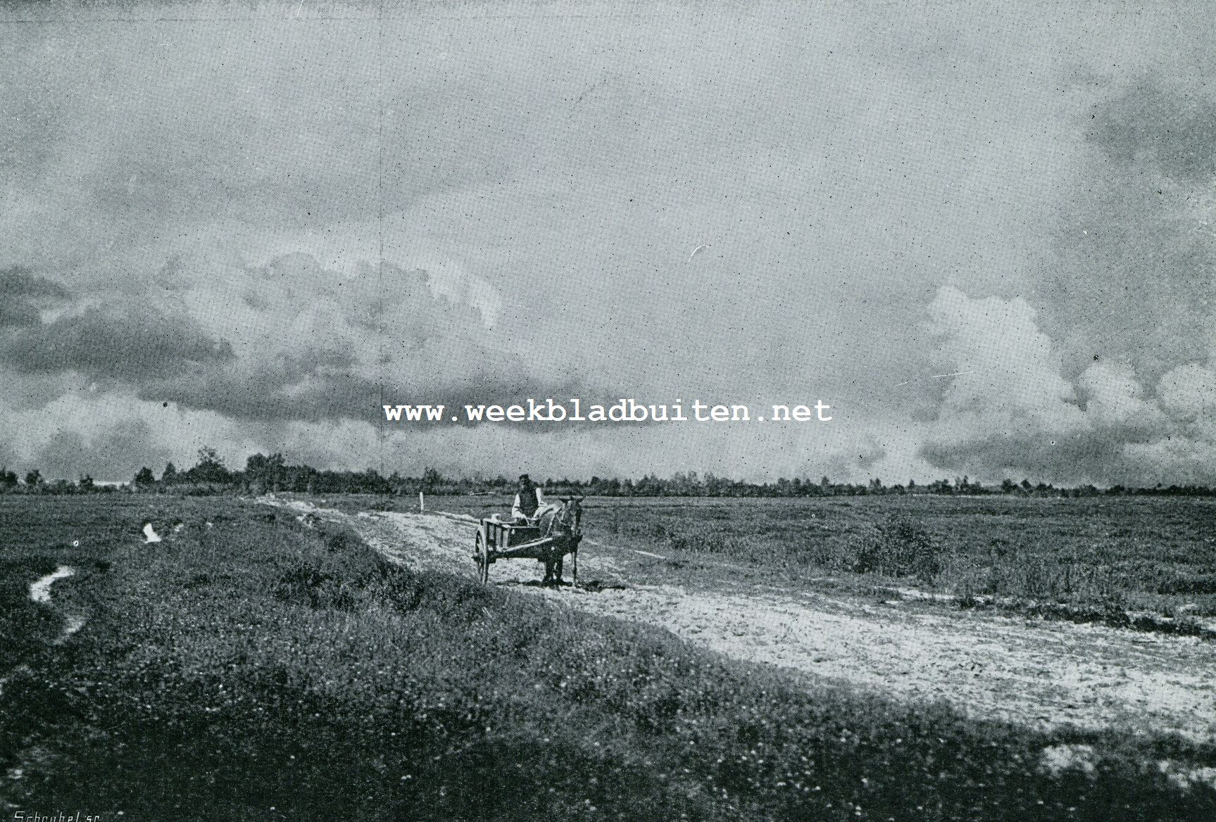 EEN KARRETJE OP DEN ZANDWEG REED . . .