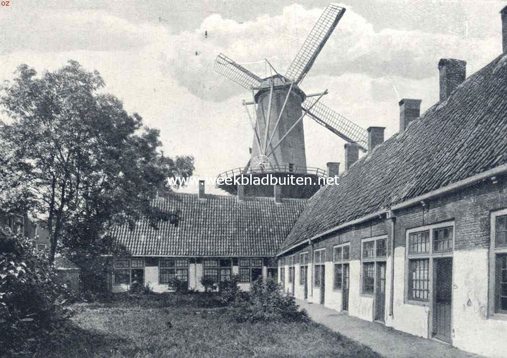 Molens. Stellingmolen te Gouda, gezien van het Roomsche Hofje